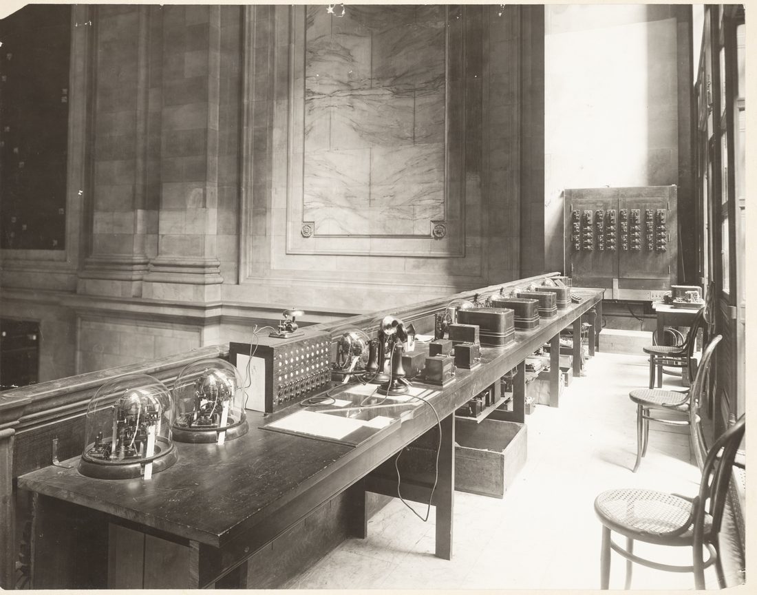 Automatic stock-ticker apparatus at the New York Stock Exchange central control station in the early 1900s